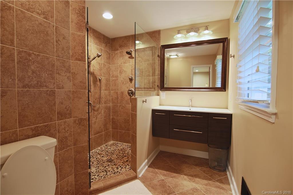 5708 Old Monroe Road Indian Trail, NC 28079 - Photo 13 of 26 a bathroom with a sink and a mirror