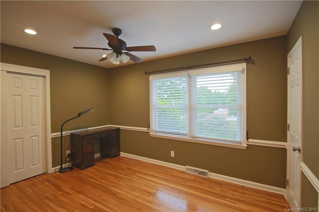 5708 Old Monroe Road Indian Trail, NC 28079 - Photo 15 of 26 a view of empty room with wooden floor and fan