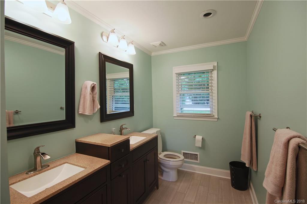 5708 Old Monroe Road Indian Trail, NC 28079 - Photo 16 of 26 a bathroom with a toilet sink and mirror