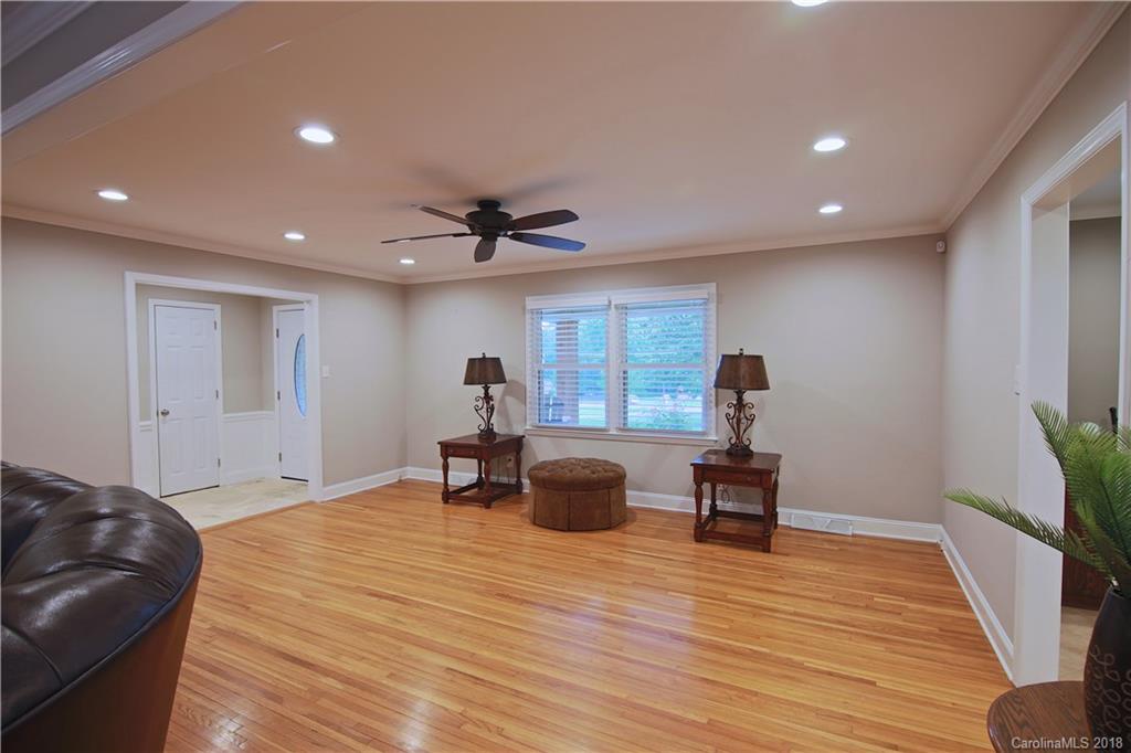 5708 Old Monroe Road Indian Trail, NC 28079 - Photo 18 of 26 a living room with furniture and a wooden floor