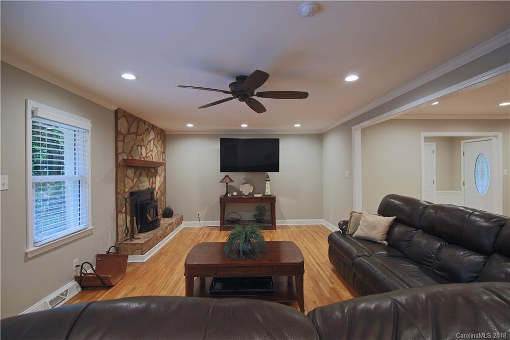 5708 Old Monroe Road Indian Trail, NC 28079 - Photo 19 of 26 a living room with furniture and a flat screen tv