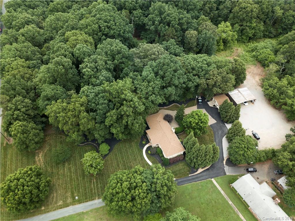 5708 Old Monroe Road Indian Trail, NC 28079 - Photo 3 of 26 an aerial view of a house with a yard and outdoor seating