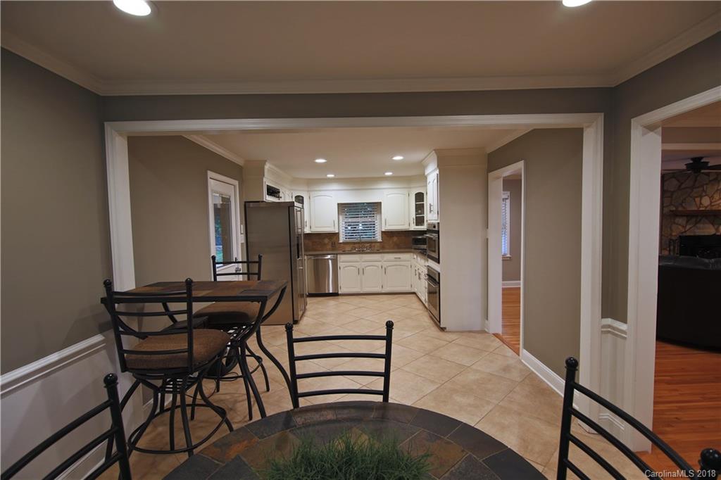 5708 Old Monroe Road Indian Trail, NC 28079 - Photo 24 of 26 a kitchen with a table and chairs