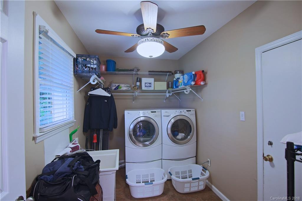 5708 Old Monroe Road Indian Trail, NC 28079 - Photo 25 of 26 a view of a hallway with washer and dryer