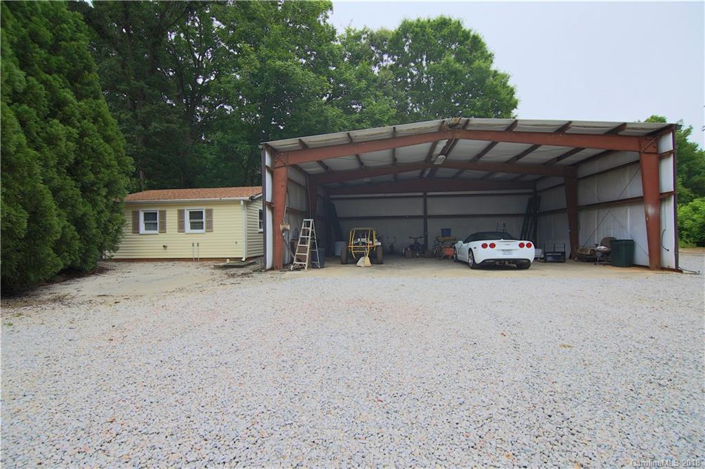 5708 Old Monroe Road Indian Trail, NC 28079 - Photo 6 of 26 a car parked in front of house