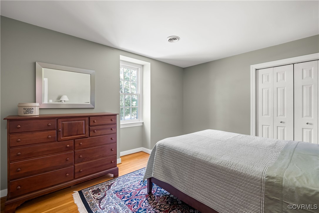 2410 Kentford Road Midlothian, VA 23113 - Photo 23 of 36 a bedroom with a bed and a dresser