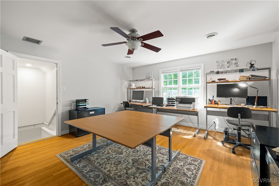 2410 Kentford Road Midlothian, VA 23113 - Photo 27 of 36 a living room with furniture a flat screen tv and a table