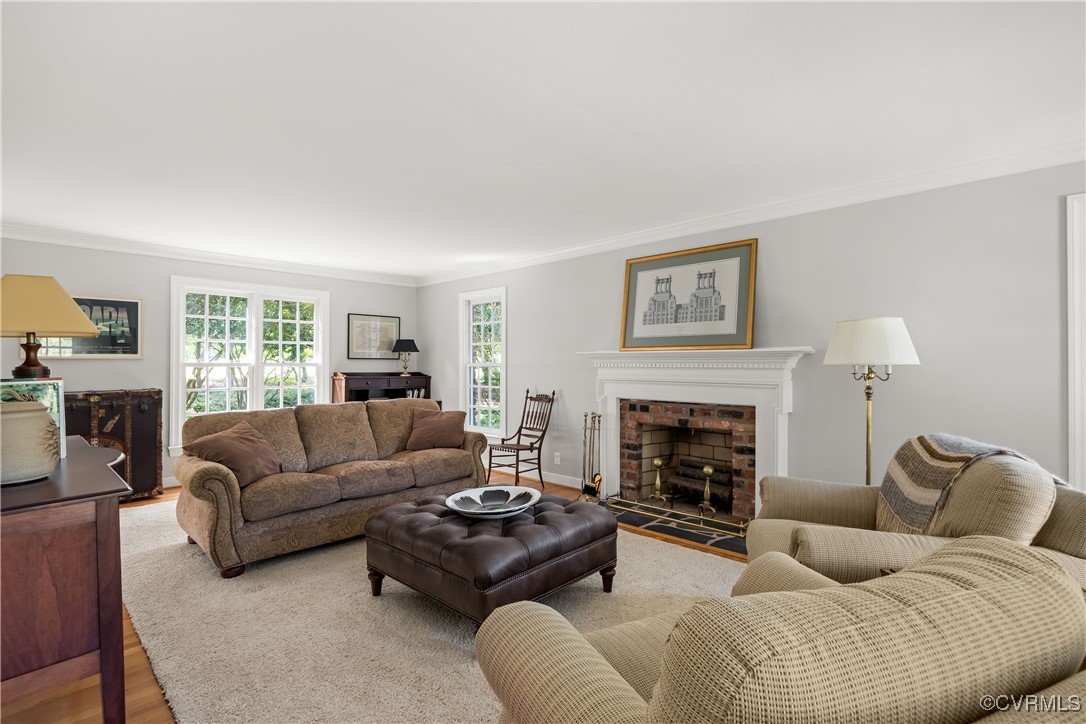 2410 Kentford Road Midlothian, VA 23113 - Photo 6 of 36 a living room with furniture and a fireplace