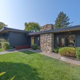 a front view of a house with garden