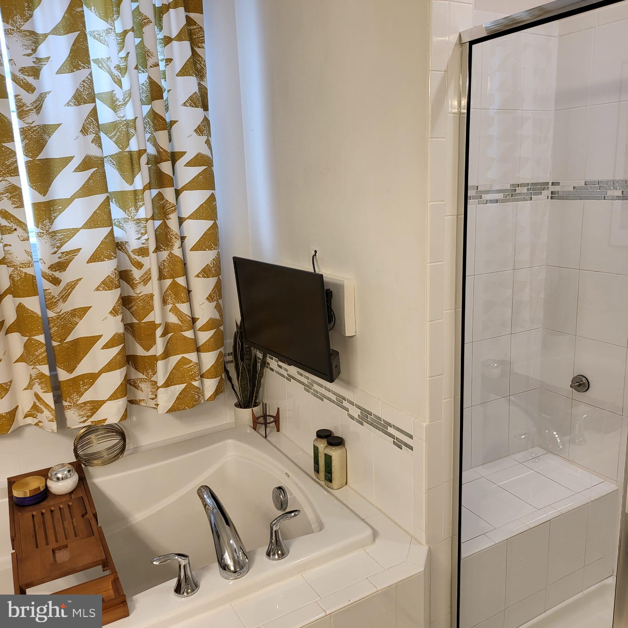 24626 Cable Mill Terrace Aldie, VA 20105 - Photo 15 of 46 a bathroom with a sink and a tub