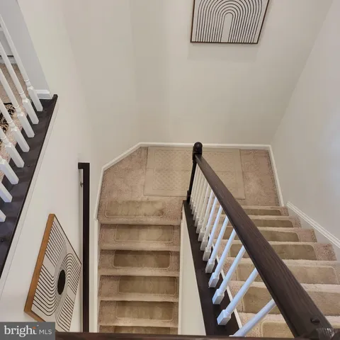 a view of entryway with stairs and wooden floor