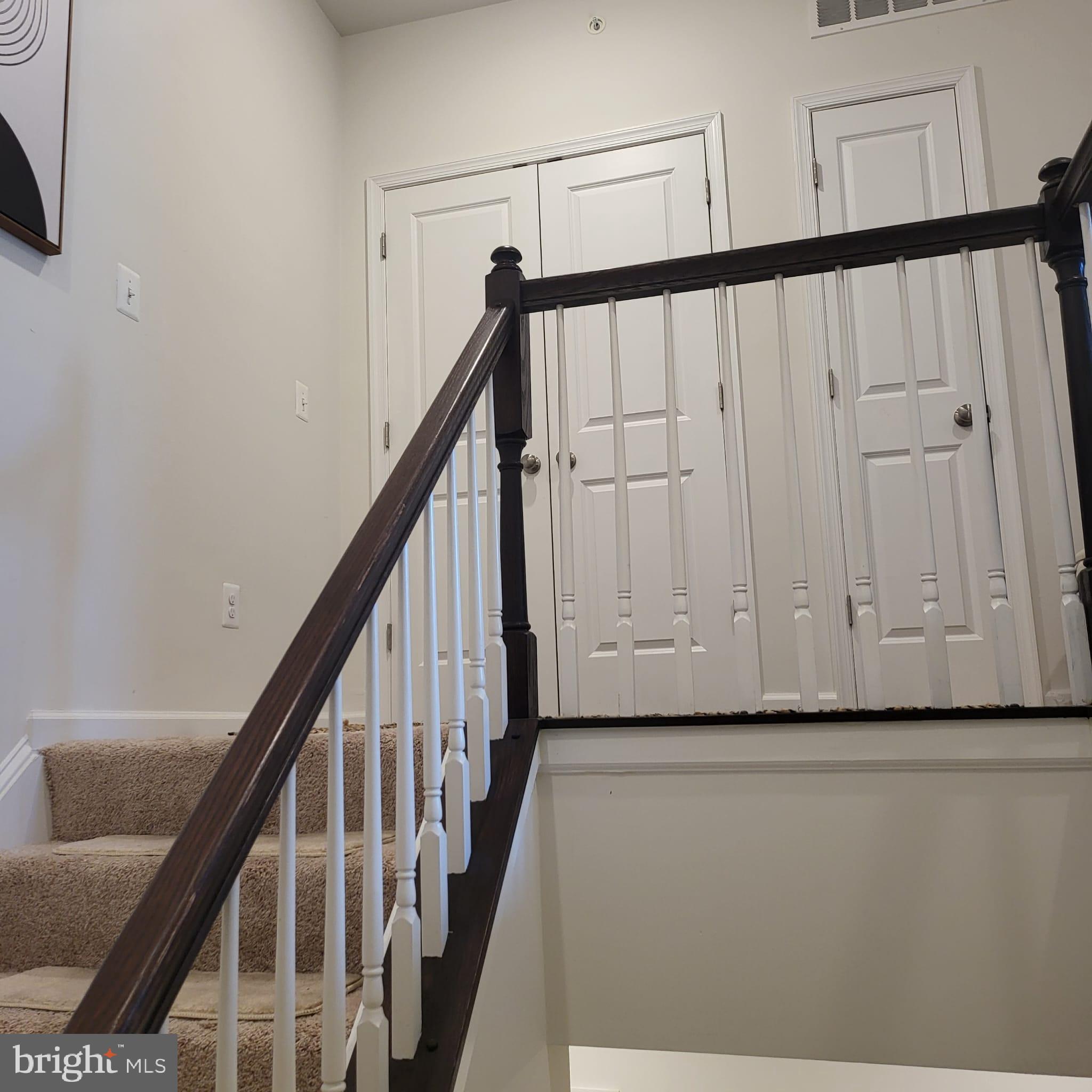 24626 Cable Mill Terrace Aldie, VA 20105 - Photo 30 of 46 a view of a hallway with wooden floor and staircase