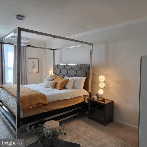 a bed room with a bed and a mirror