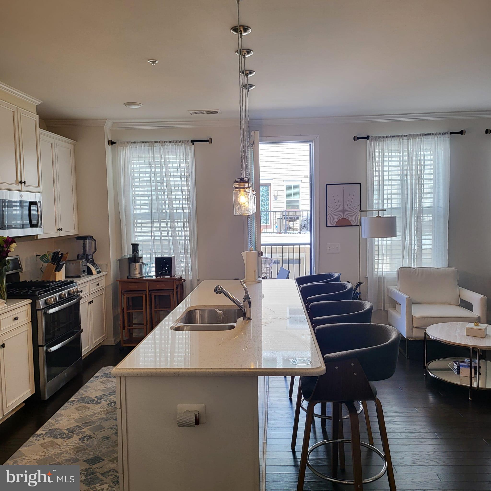 24626 Cable Mill Terrace Aldie, VA 20105 - Photo 4 of 46 a kitchen that has a sink and a stove in it
