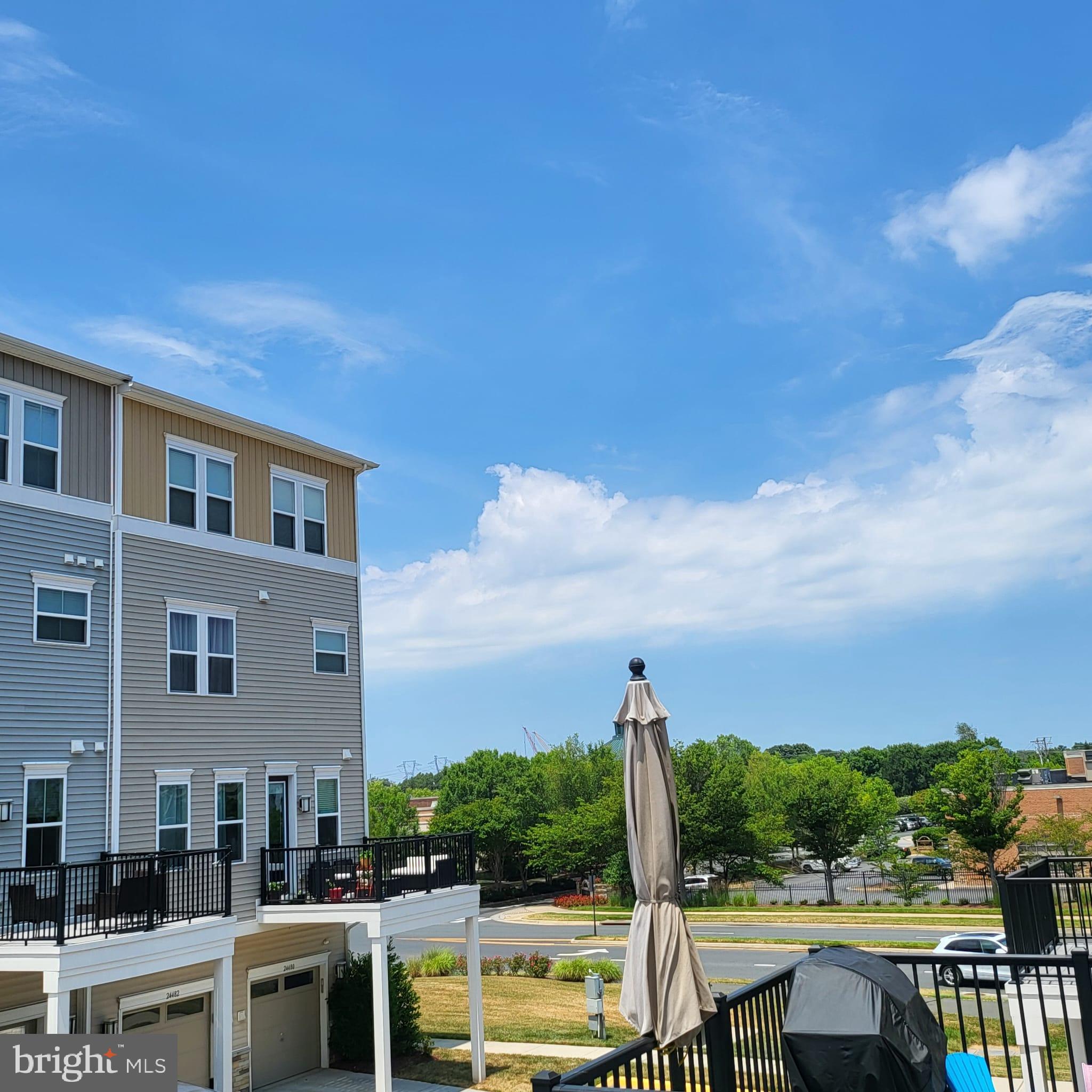 24626 Cable Mill Terrace Aldie, VA 20105 - Photo 44 of 46 a view of a swimming pool with outdoor seating and a garden