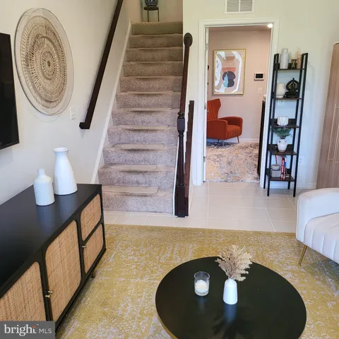 a view of hall way with furniture