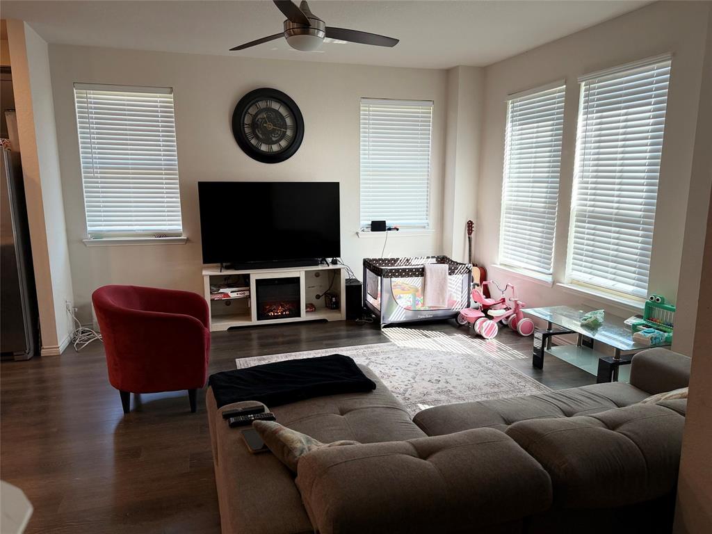 2001 Juniper Pass Way Mesquite, TX 75149 - Photo 4 of 12 Living area featuring dark wood finished floors and ceiling fan