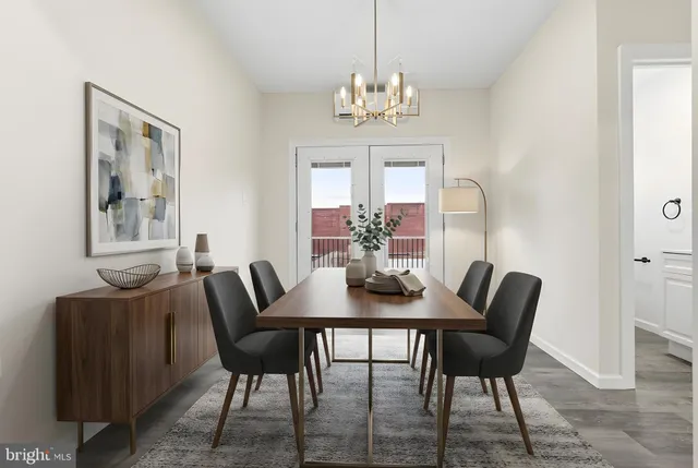 a view of a dining room with furniture and chandelier