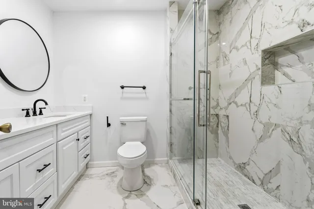 a spacious bathroom with a sink and a mirror