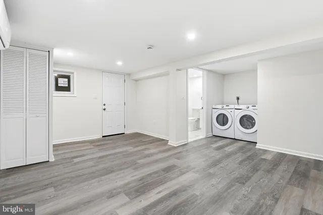 a view of a storage & utility room with washer and dryer