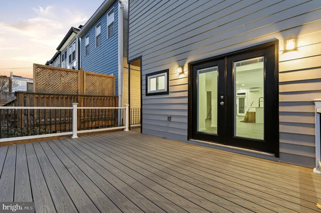 a view of a balcony with wooden floor