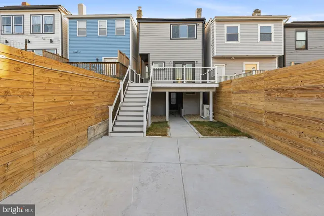 a view of a brick house with many windows