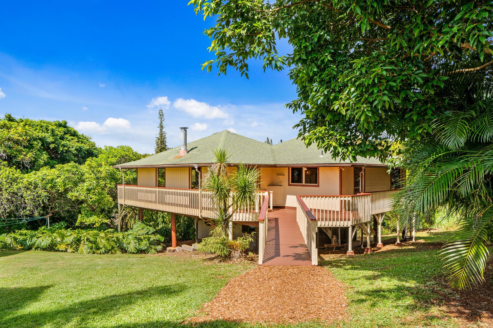 2215 Apala Place Haiku, HI 96708 - Photo 24 of 40 a front view of a house with a yard