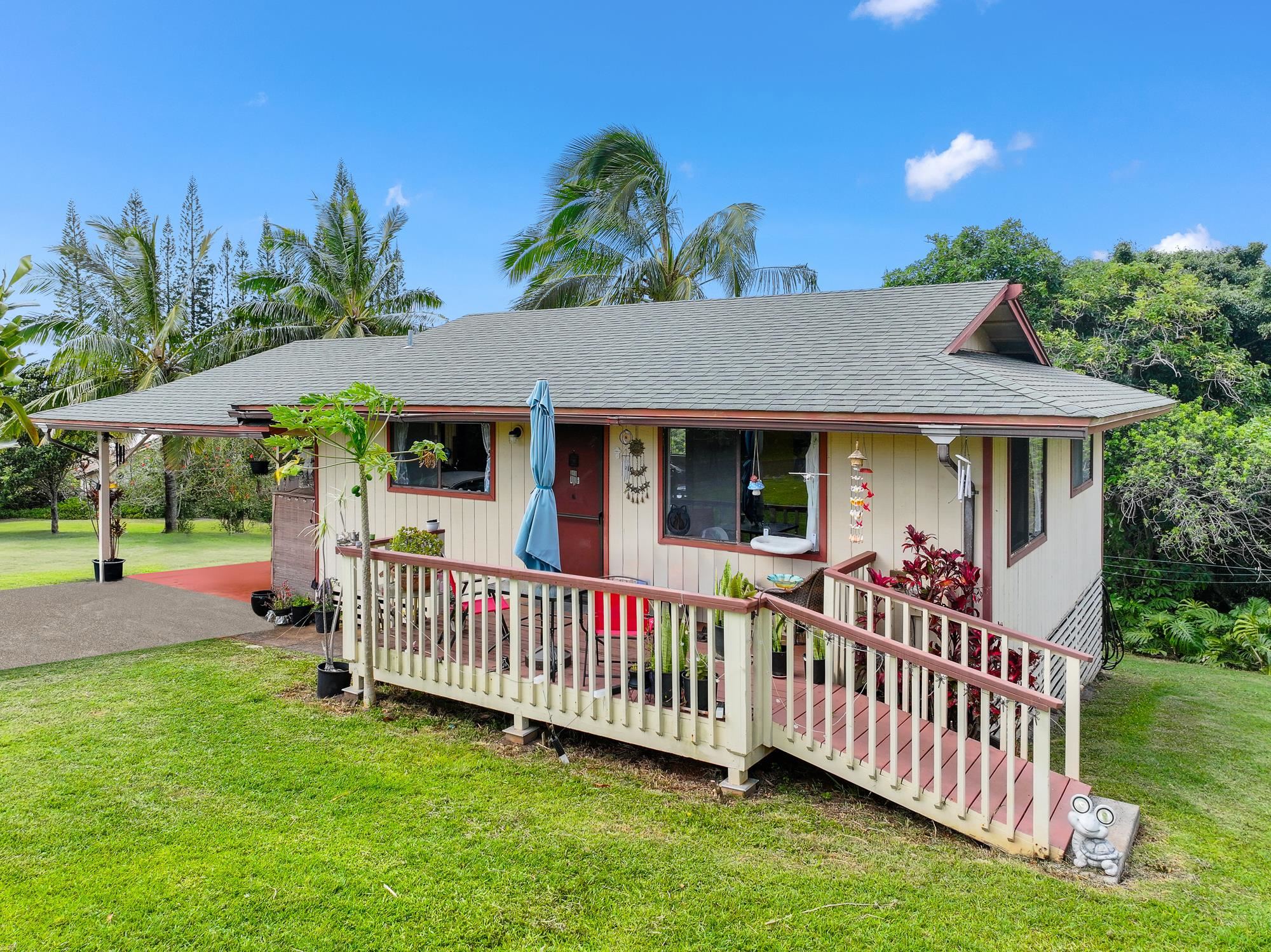 2215 Apala Place Haiku, HI 96708 - Photo 7 of 40 a view of a house with a yard and deck