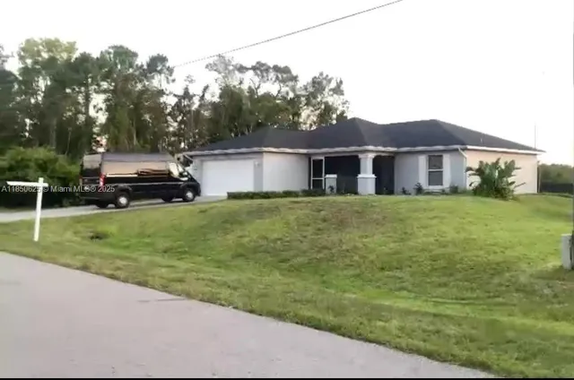 a kitchen with stainless steel appliances a sink cabinets and a stove top oven