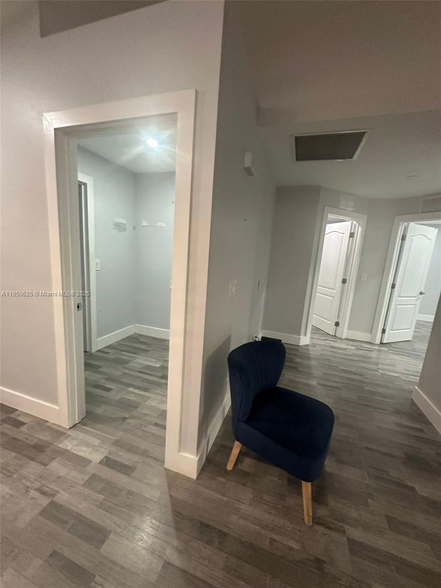 442 Conlee Street Lehigh Acres, FL 33974 - Photo 13 of 79 a view of a livingroom with furniture and hardwood floor