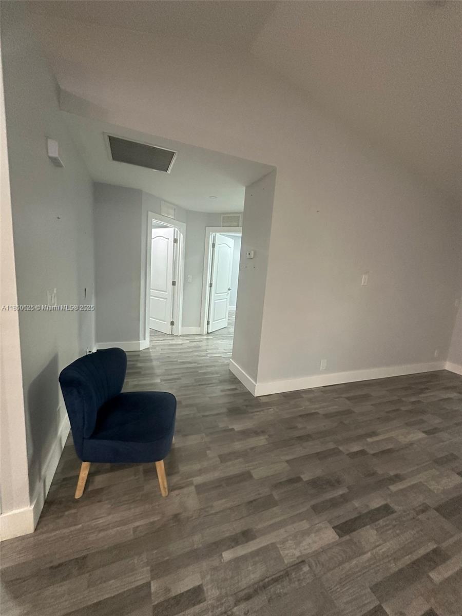 442 Conlee Street Lehigh Acres, FL 33974 - Photo 16 of 79 a view of a livingroom with furniture and wooden floor