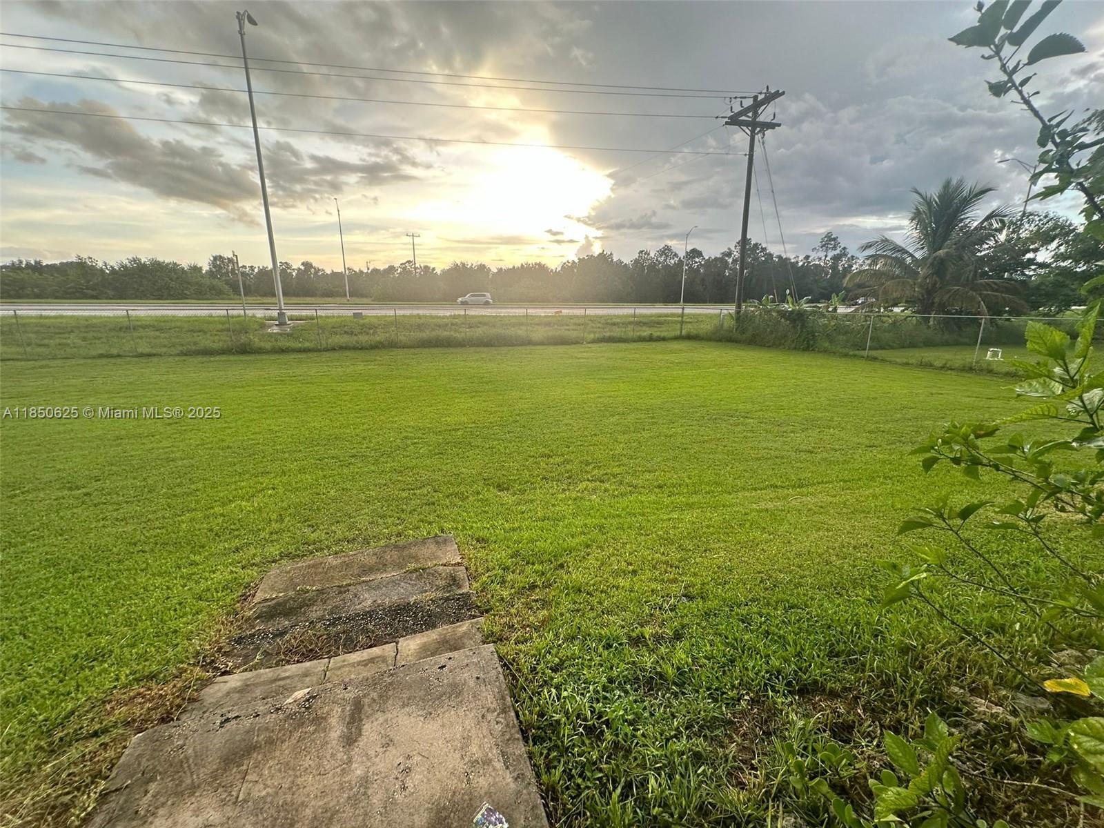 442 Conlee Street Lehigh Acres, FL 33974 - Photo 34 of 79 a view of an ocean with a big yard