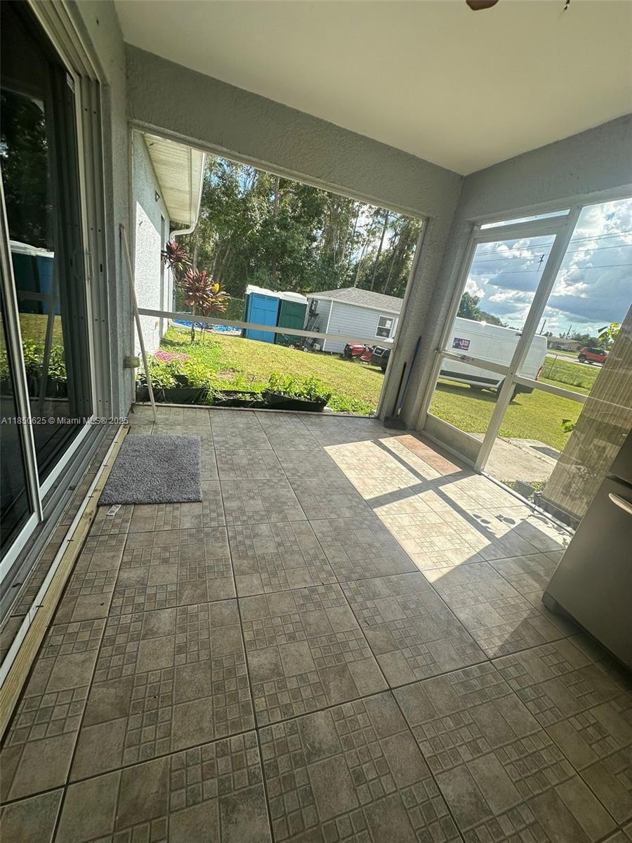 442 Conlee Street Lehigh Acres, FL 33974 - Photo 36 of 79 a view of a porch with furniture