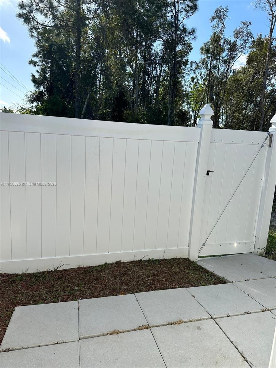 442 Conlee Street Lehigh Acres, FL 33974 - Photo 46 of 79 a view of a backyard