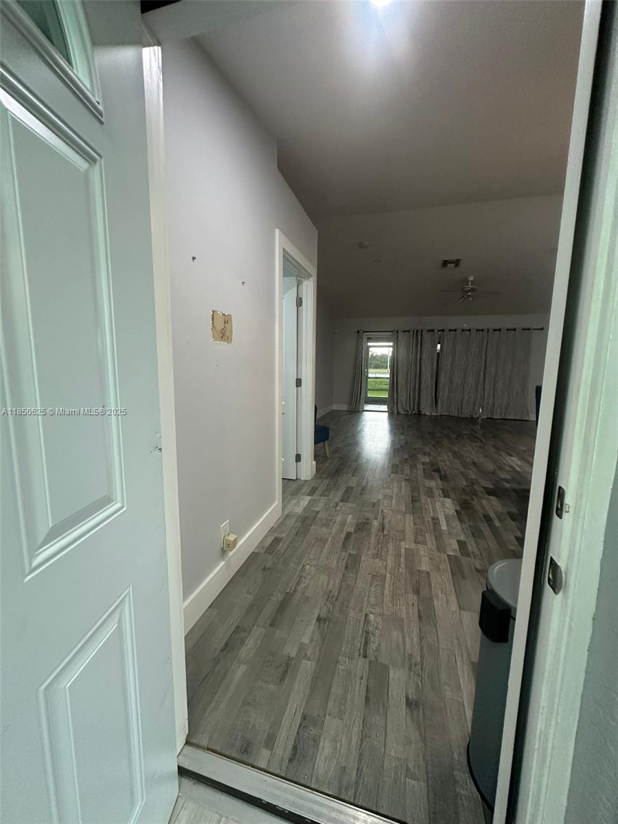 442 Conlee Street Lehigh Acres, FL 33974 - Photo 5 of 79 a view of entryway with wooden floor