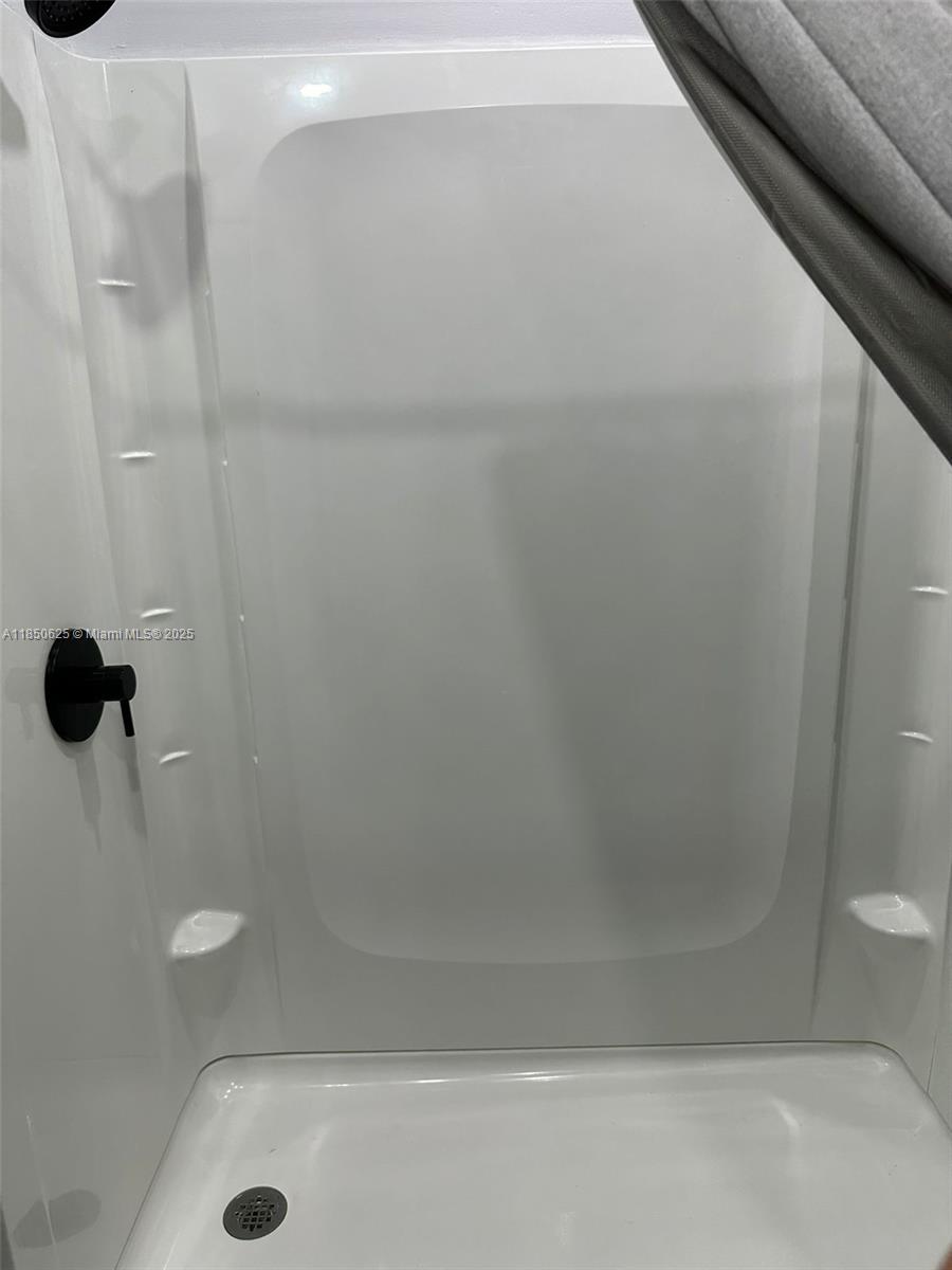 442 Conlee Street Lehigh Acres, FL 33974 - Photo 58 of 79 a bathroom with a shower