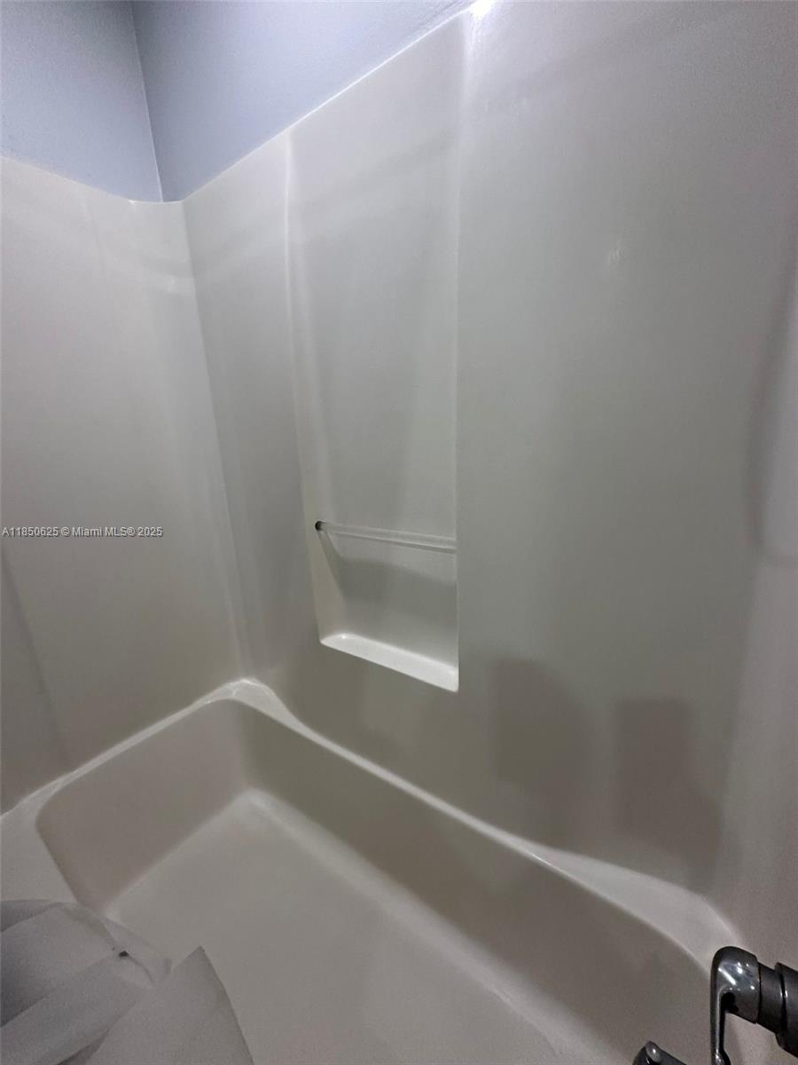 442 Conlee Street Lehigh Acres, FL 33974 - Photo 66 of 79 a close up of a bathtub