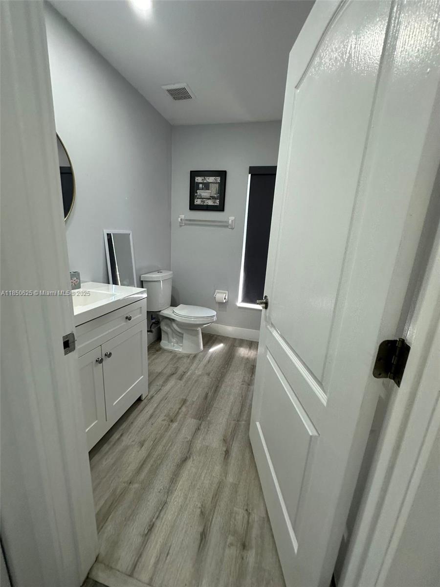 442 Conlee Street Lehigh Acres, FL 33974 - Photo 70 of 79 a view of a kitchen from the hallway