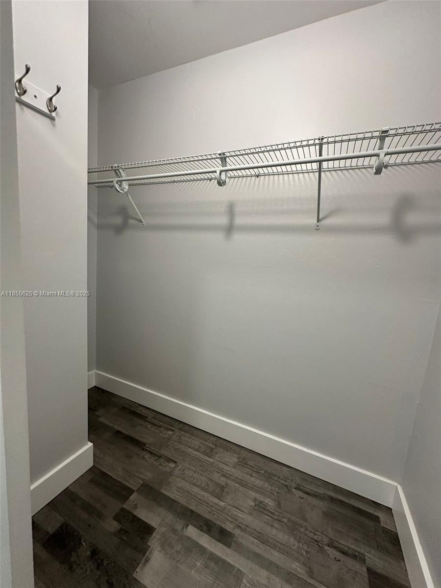 442 Conlee Street Lehigh Acres, FL 33974 - Photo 71 of 79 a view of a room with racks on the wall