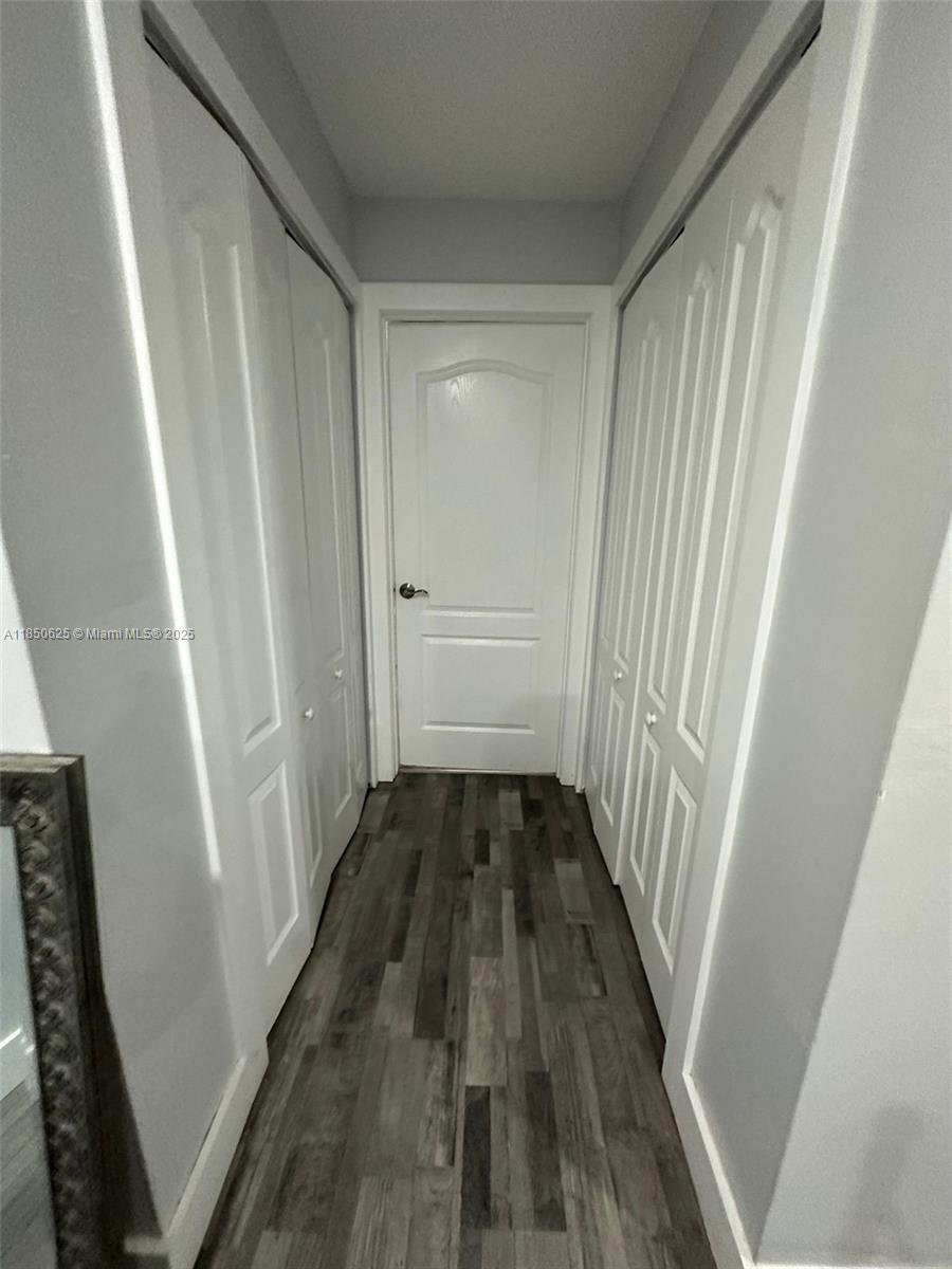 442 Conlee Street Lehigh Acres, FL 33974 - Photo 76 of 79 a view of a door and wooden floor