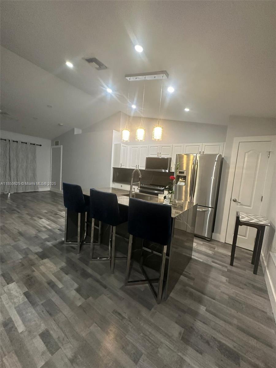 442 Conlee Street Lehigh Acres, FL 33974 - Photo 9 of 79 a view of a a dining room with furniture