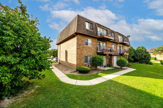 a view of a building with a yard