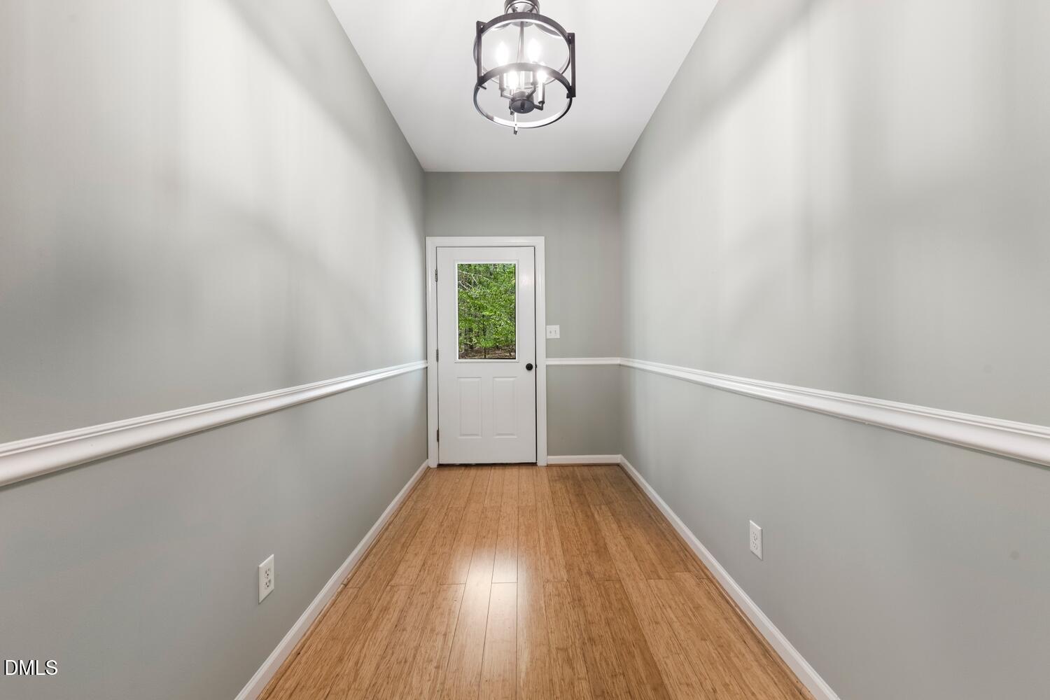 4524 Ridge Trail Efland, NC 27243 - Photo 12 of 48 a view of a hallway with wooden floor