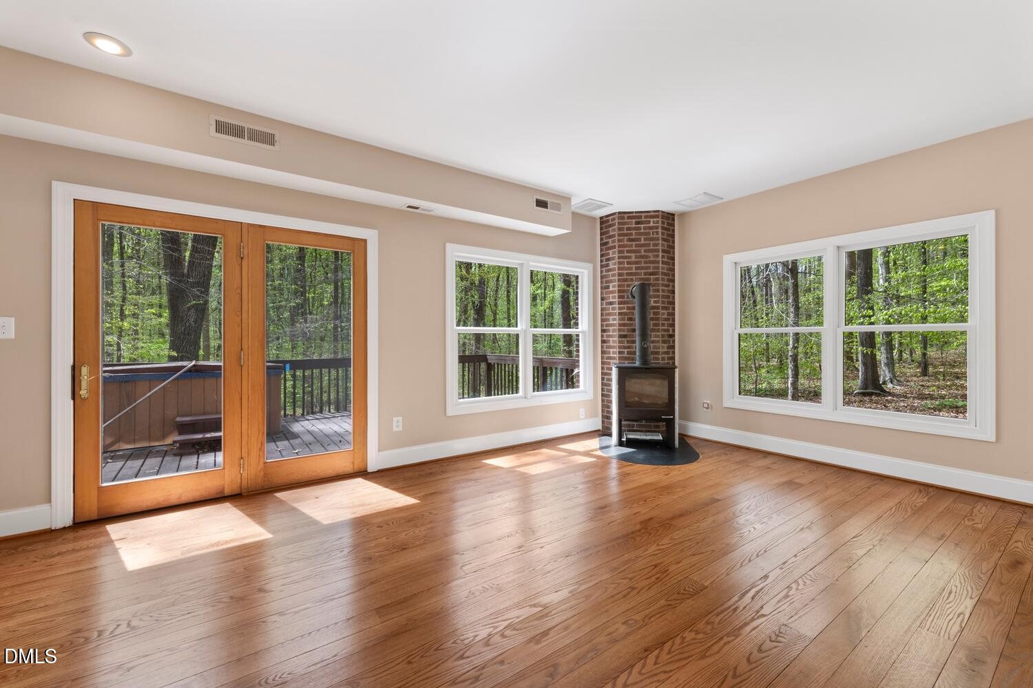 4524 Ridge Trail Efland, NC 27243 - Photo 13 of 48 a view of an empty room with wooden floor and a window
