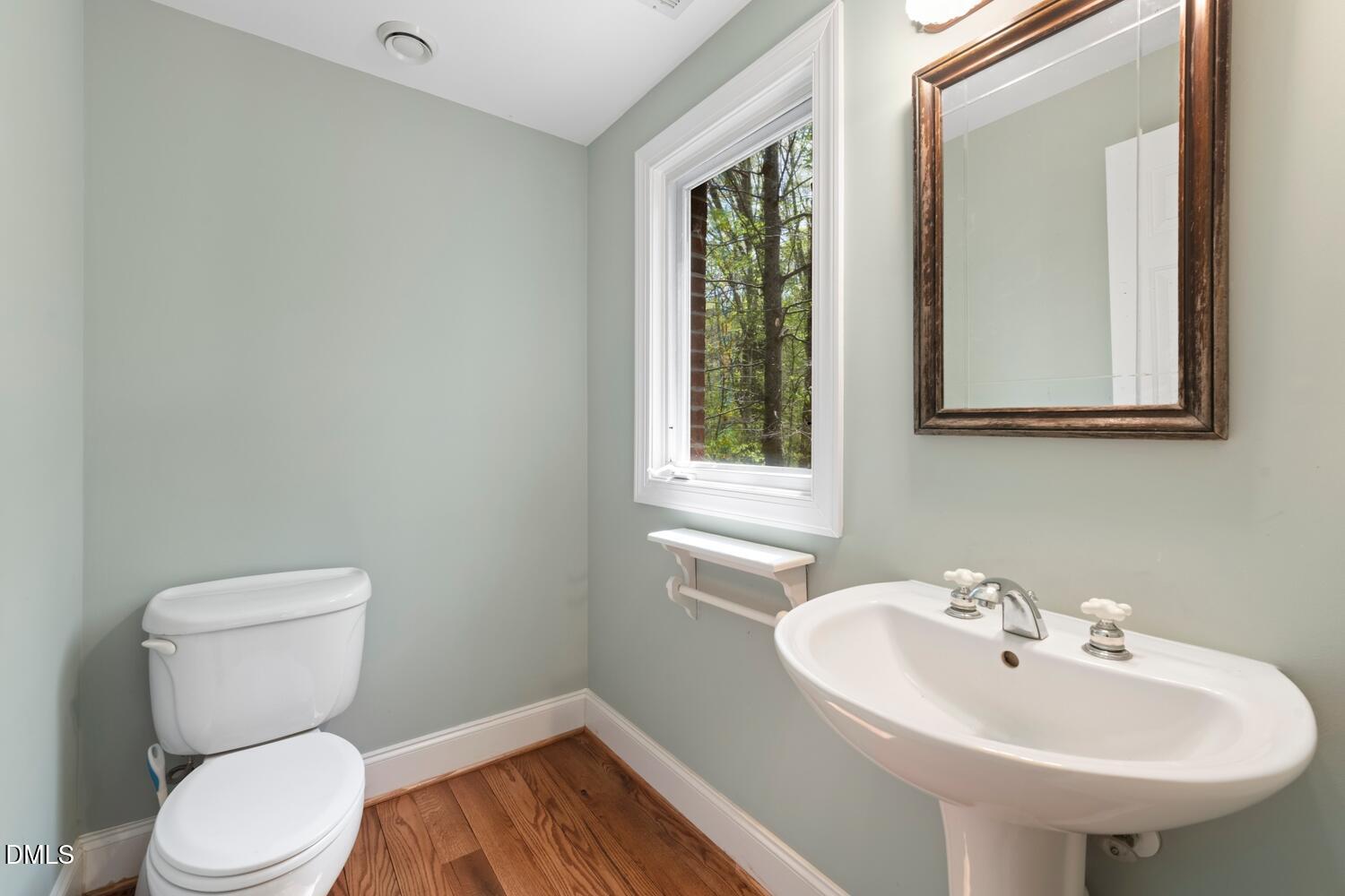 4524 Ridge Trail Efland, NC 27243 - Photo 17 of 48 a bathroom with a toilet sink and mirror