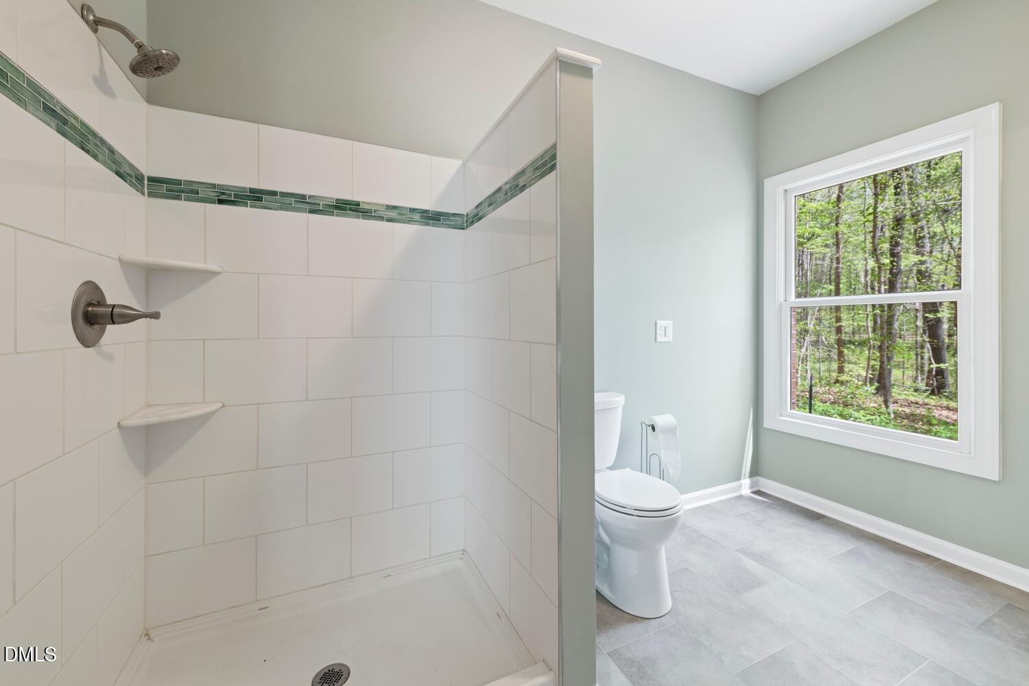 4524 Ridge Trail Efland, NC 27243 - Photo 19 of 48 a bathroom with a toilet sink and a shower