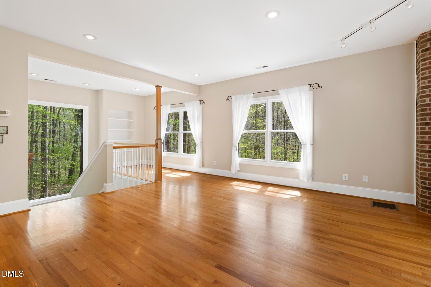 4524 Ridge Trail Efland, NC 27243 - Photo 24 of 48 a view of an empty room with wooden floor and a window