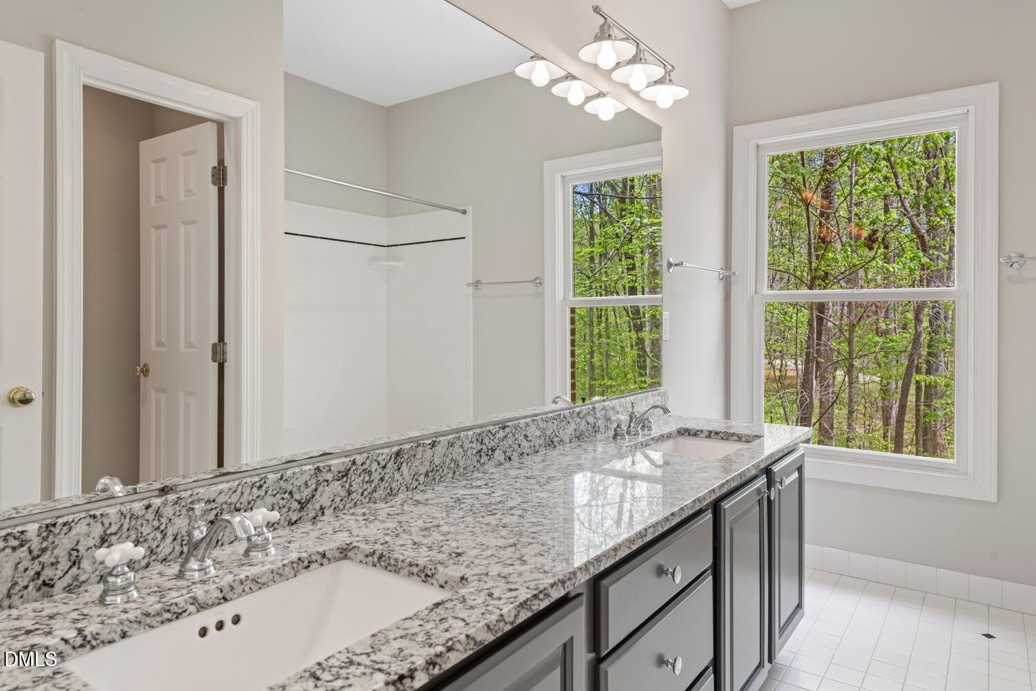 4524 Ridge Trail Efland, NC 27243 - Photo 34 of 48 a bathroom with a granite countertop sink and a window