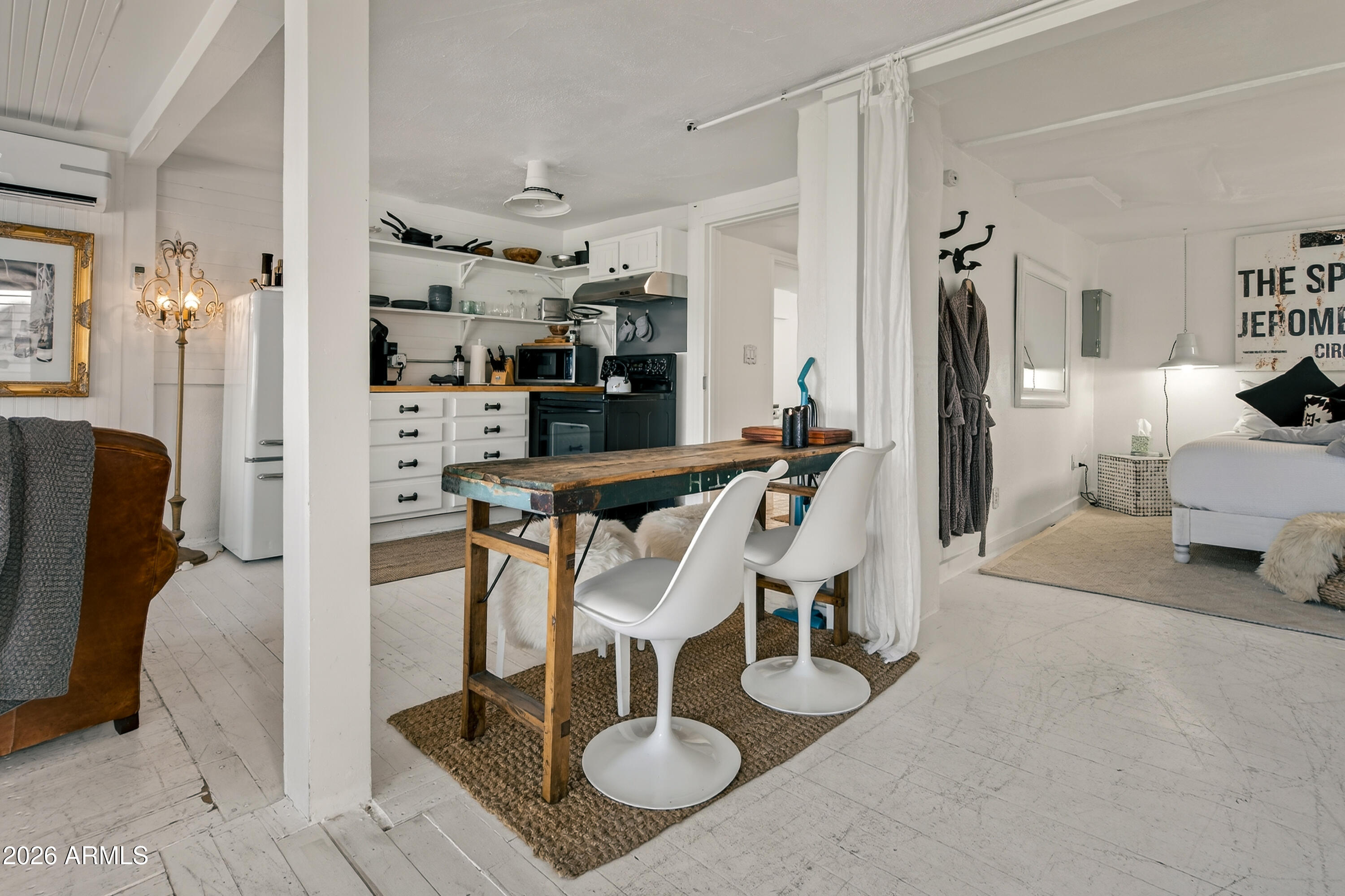 511 Main Street Jerome, AZ 86331 - Photo 15 of 67 a dining room with furniture and a chandelier