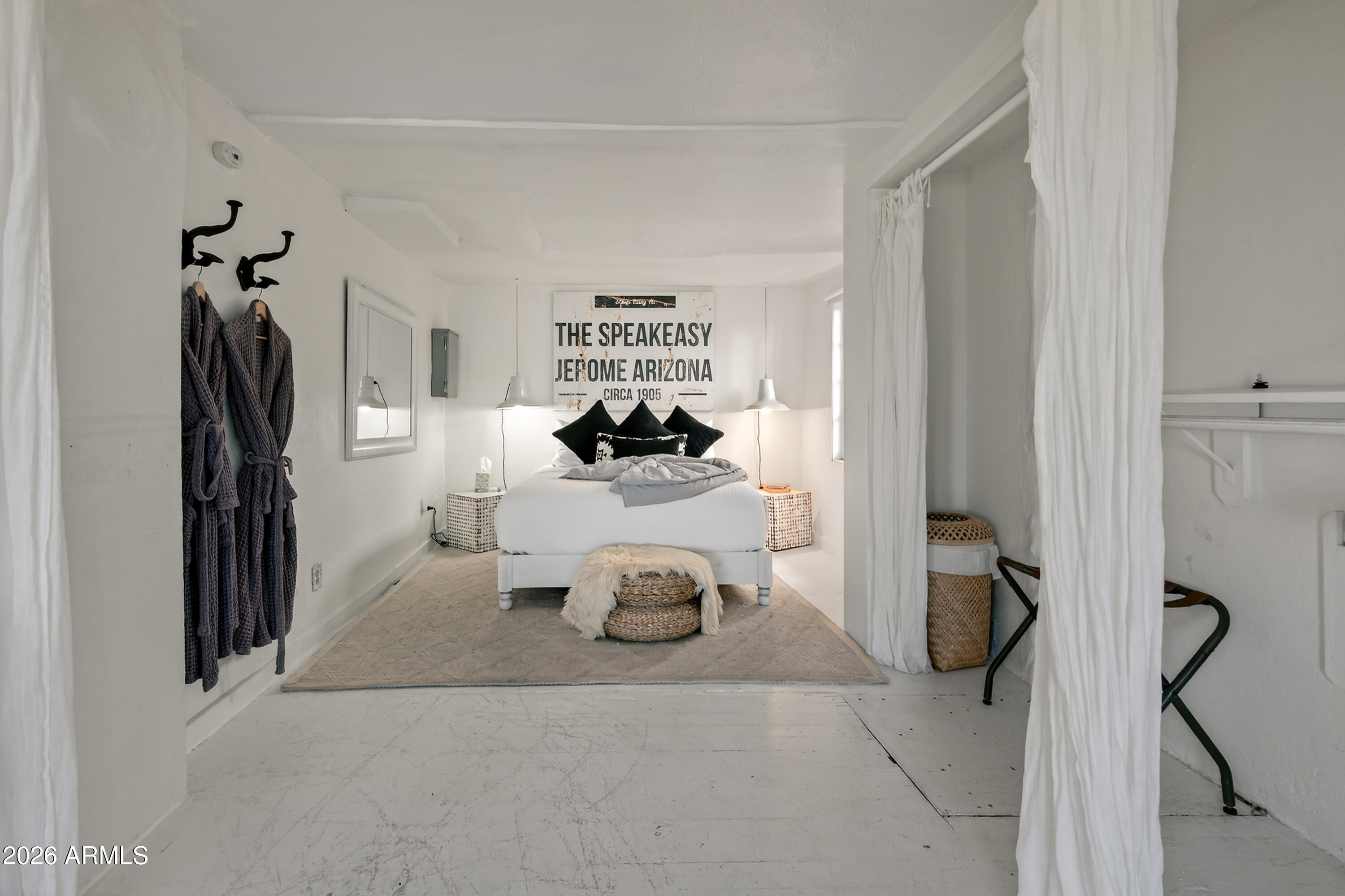 511 Main Street Jerome, AZ 86331 - Photo 16 of 67 a bedroom with a bed and a book shelf